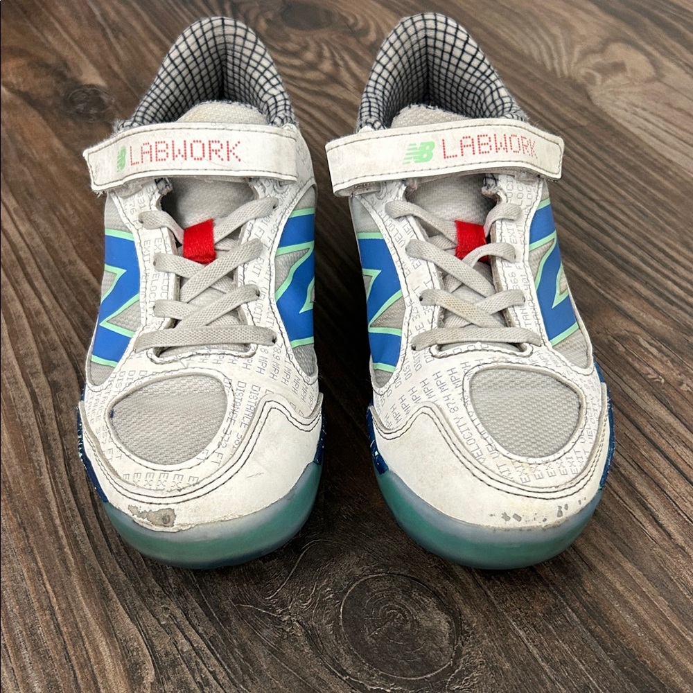 New Balance Kids' Gray and Blue turf cleats